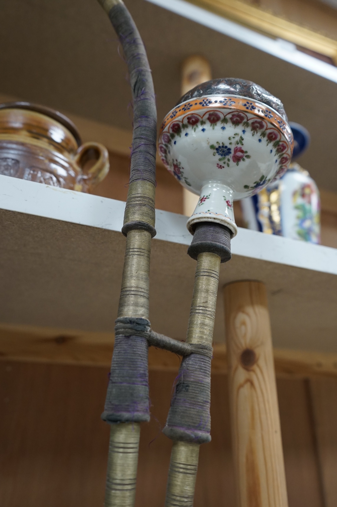 A modified silver plate, copper and porcelain hookah, 65cm